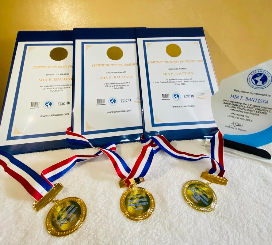 Samples of Hai English certificates, medals, and plaque